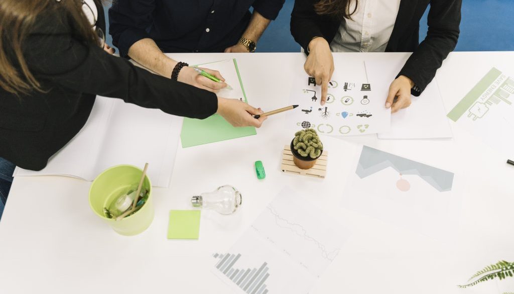 elevated-view-businesspeople-planning-natural-resources-preservation-office